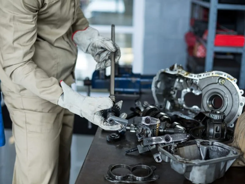 mechanic checking car parts